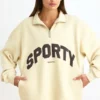 Sudadera con cremallera de un cuarto en color hueso