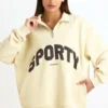 Sudadera con cremallera de un cuarto en color hueso