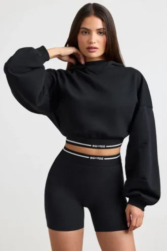 Sudadera corta con capucha de felpa de algodón elástico en negro