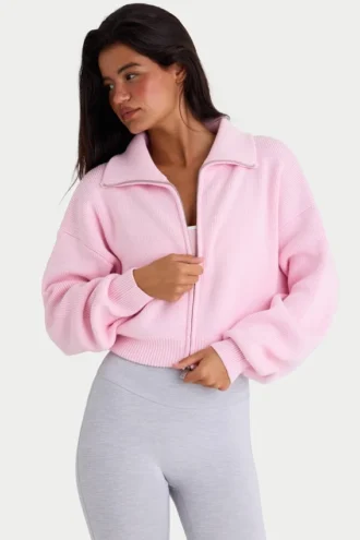 Sudadera corta con cremallera de punto acanalado en rosa pálido
