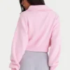 Sudadera corta con cremallera de punto acanalado en rosa pálido