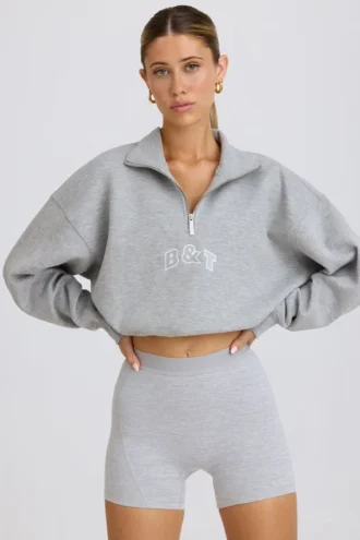 Sudadera corta con cremallera de un cuarto en gris jaspeado