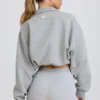 Sudadera corta con cremallera de un cuarto en gris jaspeado