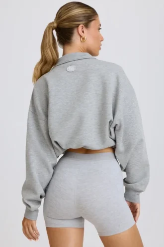 Sudadera corta con cremallera de un cuarto en gris jaspeado