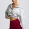 Sudadera corta con cremallera de un cuarto en gris jaspeado