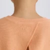 Sudadera corta con espalda abierta de jersey de algodón texturizado en color melocotón