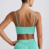 Sujetador deportivo Define Luxe con cuello en V en color menta