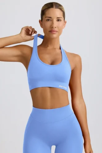Sujetador deportivo Define Luxe con cuello halter en azul claro