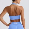 Sujetador deportivo Define Luxe con cuello halter en azul claro