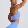 Sujetador deportivo Define Luxe con cuello halter en azul claro