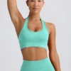 Sujetador deportivo Define Luxe con cuello halter en color menta
