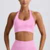 Sujetador deportivo Define Luxe con cuello halter en rosa chicle