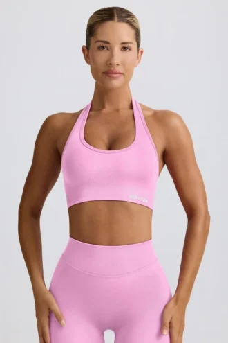 Sujetador deportivo Define Luxe con cuello halter en rosa chicle