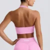 Sujetador deportivo Define Luxe con cuello halter en rosa chicle