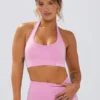 Sujetador deportivo Define Luxe con cuello halter en rosa chicle