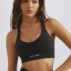 Sujetador deportivo Define Luxe con escote pronunciado en negro