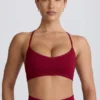 Sujetador deportivo sin costuras con espalda cruzada Super Sculpt en color burdeos