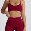 Sujetador deportivo sin costuras con espalda cruzada Super Sculpt en color burdeos