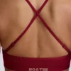 Sujetador deportivo sin costuras con espalda cruzada Super Sculpt en color burdeos