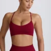 Sujetador deportivo sin costuras con espalda cruzada Super Sculpt en color burdeos