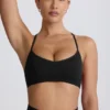 Sujetador deportivo sin costuras con espalda cruzada Super Sculpt en negro