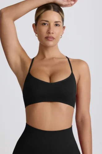 Sujetador deportivo sin costuras con espalda cruzada Super Sculpt en negro