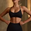 Sujetador deportivo sin costuras con espalda cruzada Super Sculpt en negro