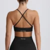 Sujetador deportivo sin costuras con espalda cruzada Super Sculpt en negro