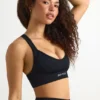 Sujetador deportivo sin costuras con espalda cruzada Super Sculpt en negro