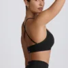 Sujetador deportivo sin costuras con espalda cruzada Super Sculpt en negro