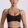 Sujetador deportivo sin costuras con espalda cruzada Super Sculpt en negro