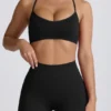 Sujetador deportivo sin costuras con espalda cruzada Super Sculpt en negro