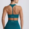 Sujetador deportivo sin costuras con espalda en T Super Sculpt en color verde azulado