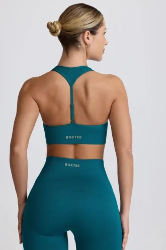 Sujetador deportivo sin costuras con espalda en T Super Sculpt en color verde azulado