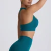 Sujetador deportivo sin costuras con espalda en T Super Sculpt en color verde azulado