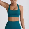 Sujetador deportivo sin costuras con espalda en T Super Sculpt en color verde azulado
