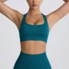 Sujetador deportivo sin costuras con espalda en T Super Sculpt en color verde azulado
