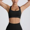 Sujetador deportivo sin costuras con espalda en T Super Sculpt en negro