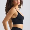 Sujetador deportivo sin costuras Super Sculpt con cuello redondo en negro