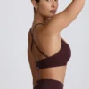 Sujetador deportivo sin costuras Super Sculpt con espalda cruzada en color chocolate
