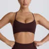 Sujetador deportivo sin costuras Super Sculpt con espalda cruzada en color chocolate