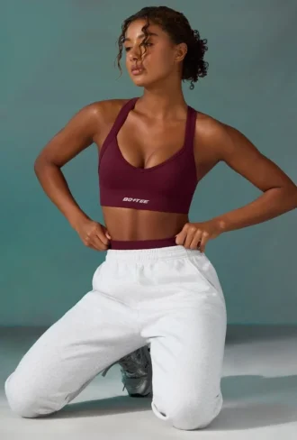 Sujetador deportivo sin costuras Super Sculpt con espalda cruzada en color ciruela