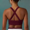 Sujetador deportivo sin costuras Super Sculpt con espalda cruzada en color ciruela