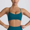Sujetador deportivo sin costuras Super Sculpt con espalda cruzada en color verde azulado