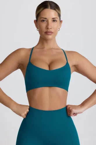 Sujetador deportivo sin costuras Super Sculpt con espalda cruzada en color verde azulado