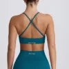 Sujetador deportivo sin costuras Super Sculpt con espalda cruzada en color verde azulado