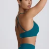 Sujetador deportivo sin costuras Super Sculpt con espalda cruzada en color verde azulado