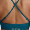 Sujetador deportivo sin costuras Super Sculpt con espalda cruzada en color verde azulado