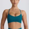 Sujetador deportivo sin costuras Super Sculpt con espalda cruzada en color verde azulado