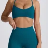 Sujetador deportivo sin costuras Super Sculpt con espalda cruzada en color verde azulado